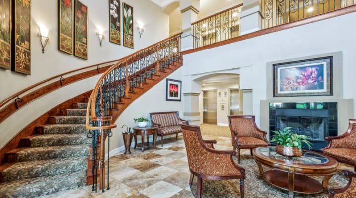 Interior view of a welcoming lobby area with a staircase