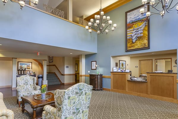 Bright lobby area with floral decor and seating