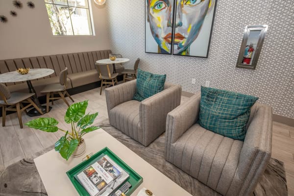 Interior lounge area with colorful artwork and seating