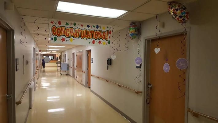 Celebratory hallway with decorations and a banner