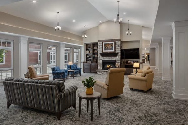 Lounge area with comfortable seating and a fireplace