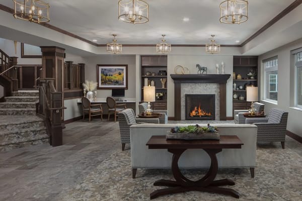 Stylish common area with seating and a fireplace