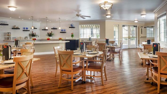 Bright dining room with wooden tables and chairs