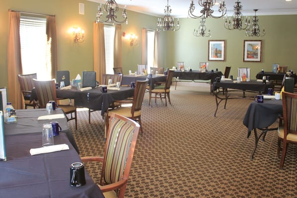 Dining area with tables set for a meal.