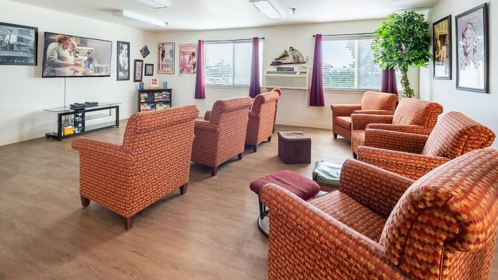 Cozy common area with seating and television