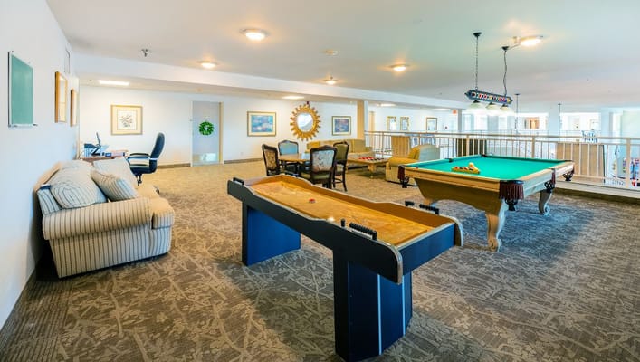 Interior common area with pool table and seating