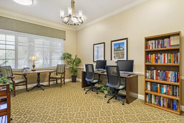 Cozy interior of a common area with computers and bookshelves