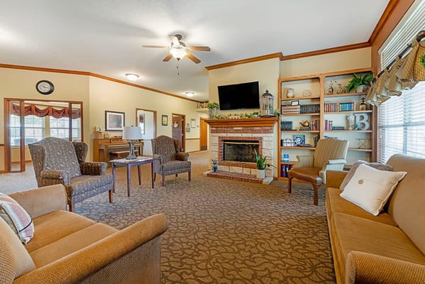 Cozy common area with seating and a fireplace