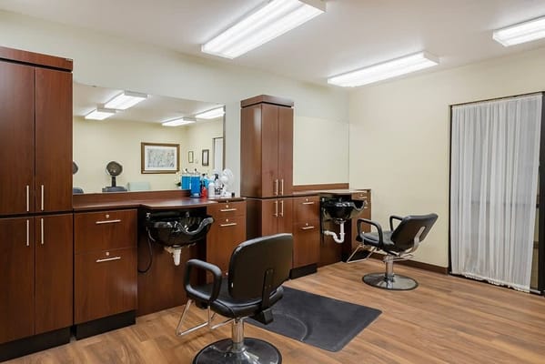 Beauty salon interior with styling chairs and mirrors