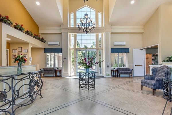 Interior view of a common area with seating and natural light