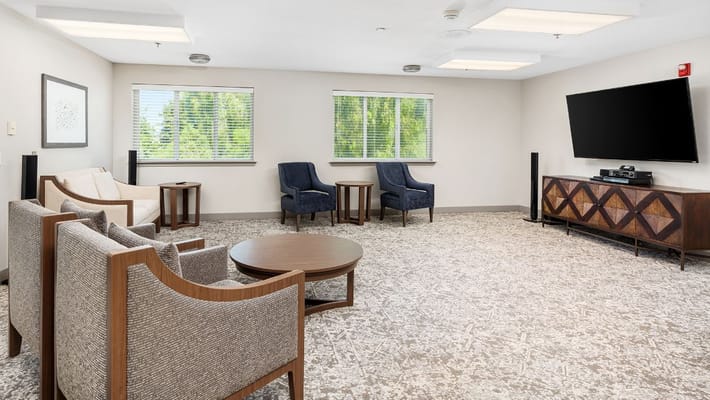 Spacious living room with seating and a television
