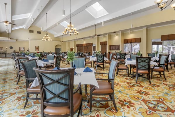 Elegant dining room with tables set for a meal