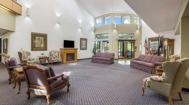 Spacious lobby with seating and fireplace at Solista Grants Pass