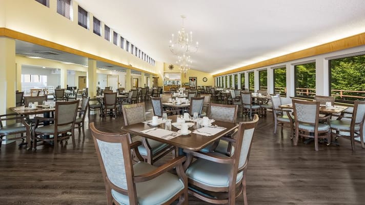 Spacious dining room with tables set for dining