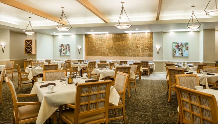 Dining room with tables set for meals