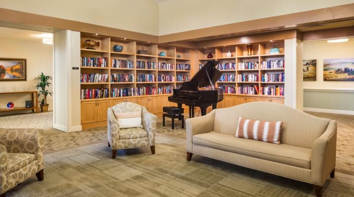 Interior common area with seating and bookshelves