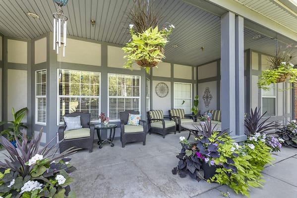 Cozy outdoor seating area with plants and decor