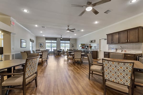 Dining room with tables and chairs in a bright interior