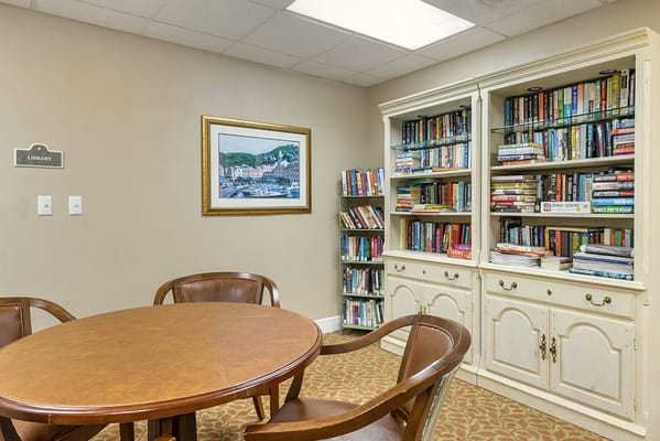 Cozy library with bookshelves and a table