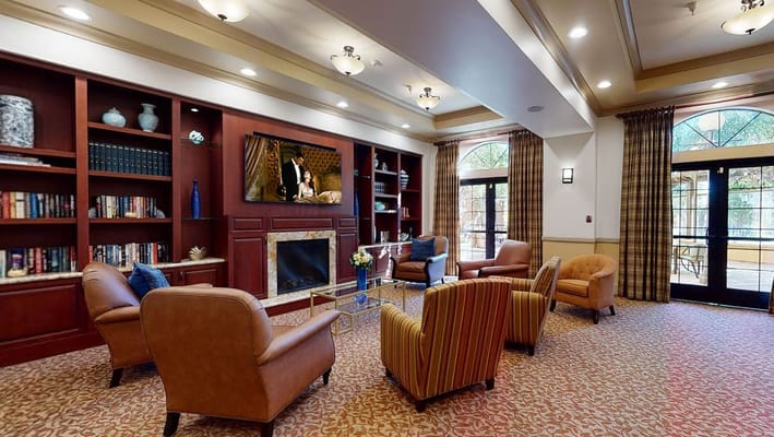 Interior common area with comfortable seating and a TV