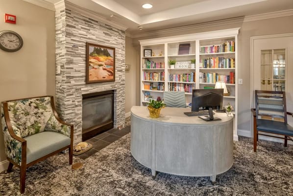 Welcoming reception desk with a bookshelf in the background