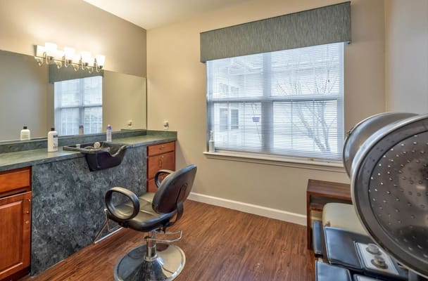 Hair salon interior with styling chair and mirror