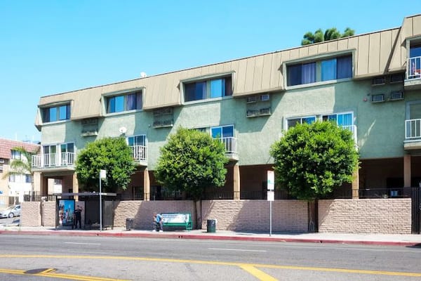Exterior of Grandview Retirement Center with green walls and trees