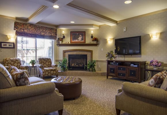 Comfortable common area with seating and fireplace