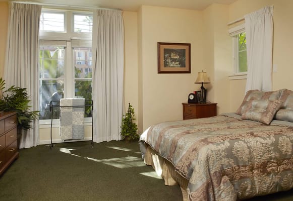 Cozy bedroom with a view and decorative bedding