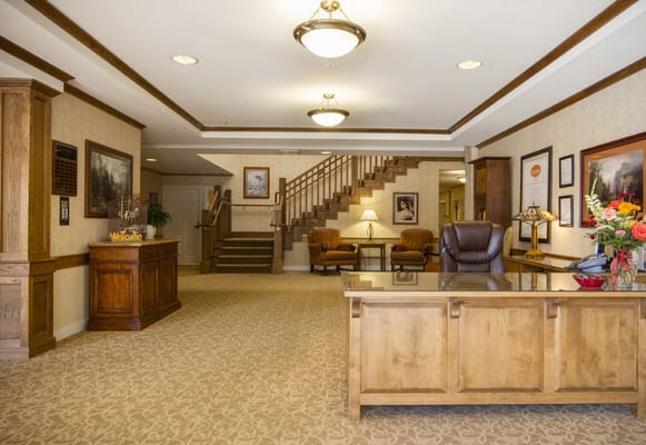 Welcoming reception area with seating and stairs