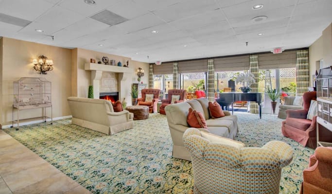 Bright common area with comfortable seating and large windows