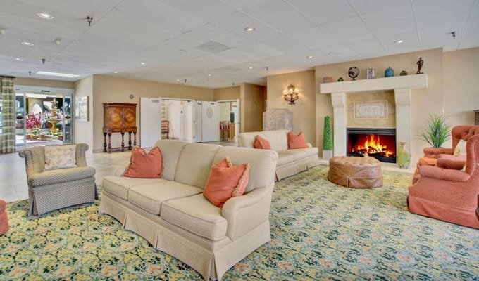 Cozy common area with seating and a fireplace