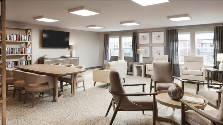 Spacious living room with seating and bookshelf