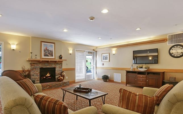 Cozy common area with comfortable seating and a fireplace