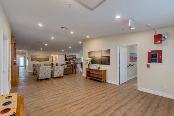 Bright interior common area with seating and art