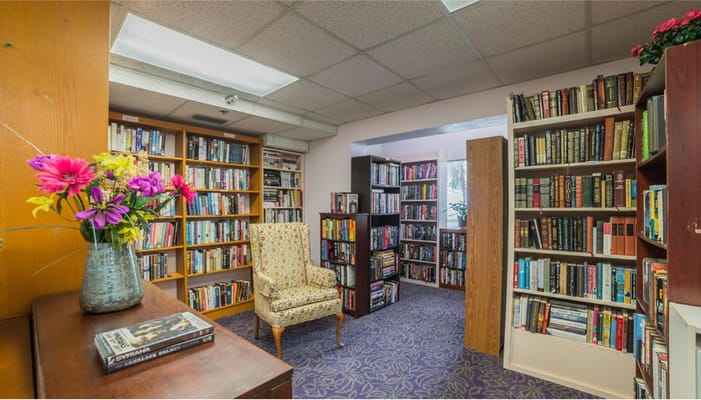Cozy library corner with bookshelves and a chair