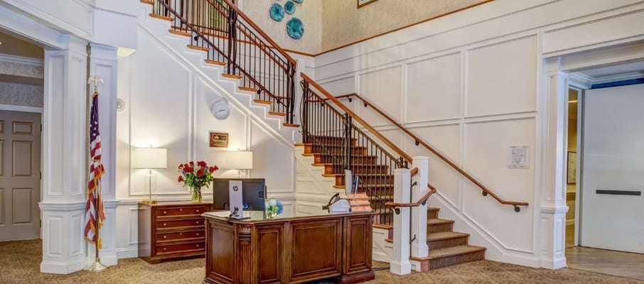Lobby area featuring a reception desk and staircase
