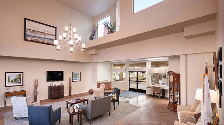 Spacious and well-lit lobby area with seating and decorative elements.