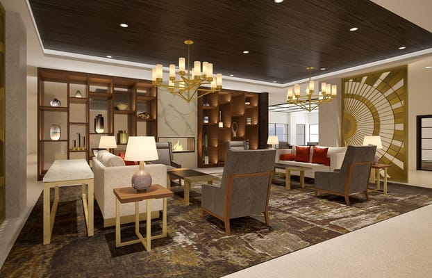 Lounge area featuring comfortable seating and decorative shelving