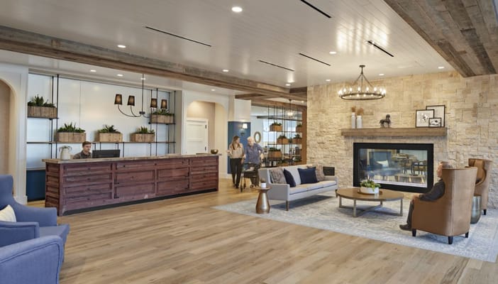 Interior lobby with staff and residents interacting