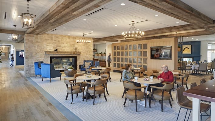 Interior common area with residents and seating