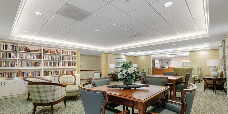 Interior common area with seating and bookshelves