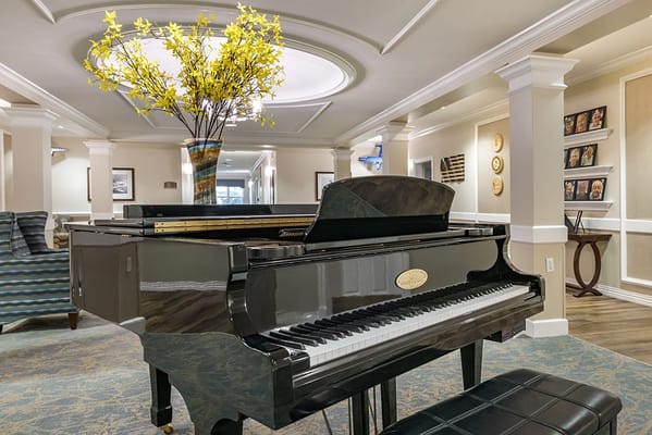 Interior view of a common area with a piano