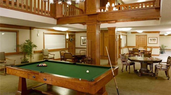 Interior common area with a pool table and seating