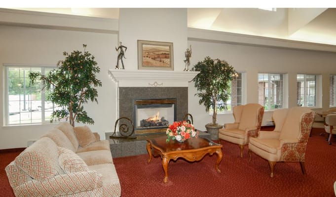 Cozy common area with a fireplace and seating