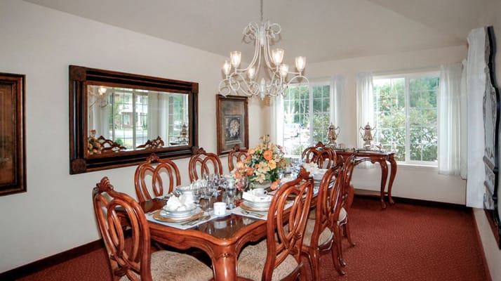 Dining room set up for a meal with elegant decor