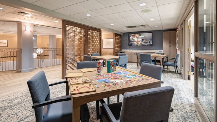 Cozy activity room with tables and puzzle games