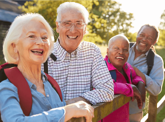 Group of smiling seniors enjoying the outdoors