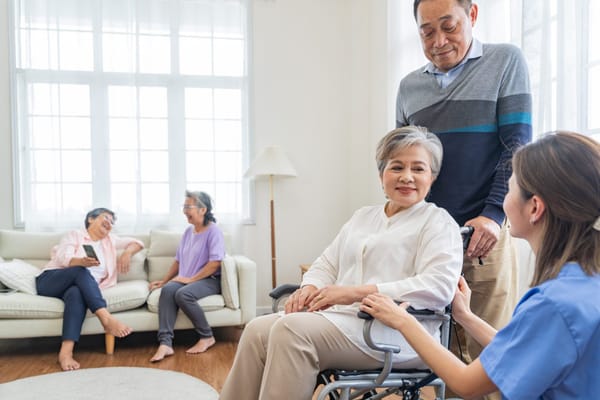 Residents and staff interacting in a cozy common area