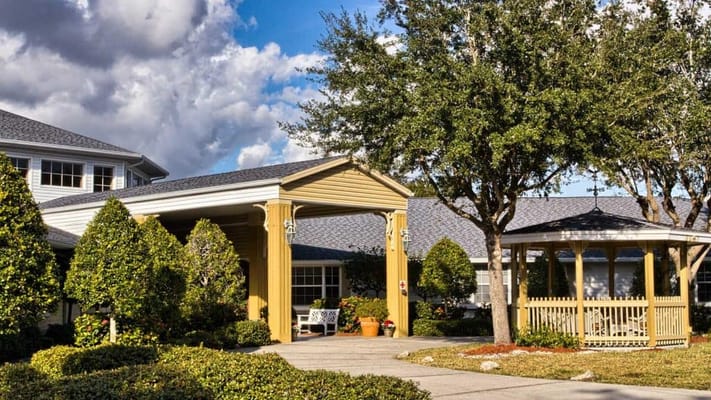 Exterior view of Heron Club entrance with landscaping